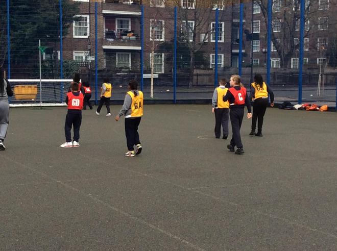 Pupils playing netball