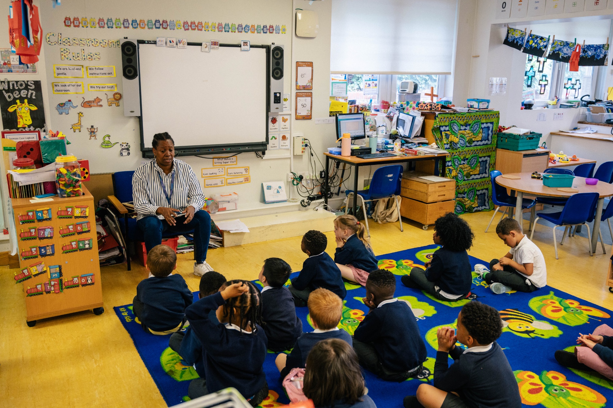 Teacher speaking to a reception class