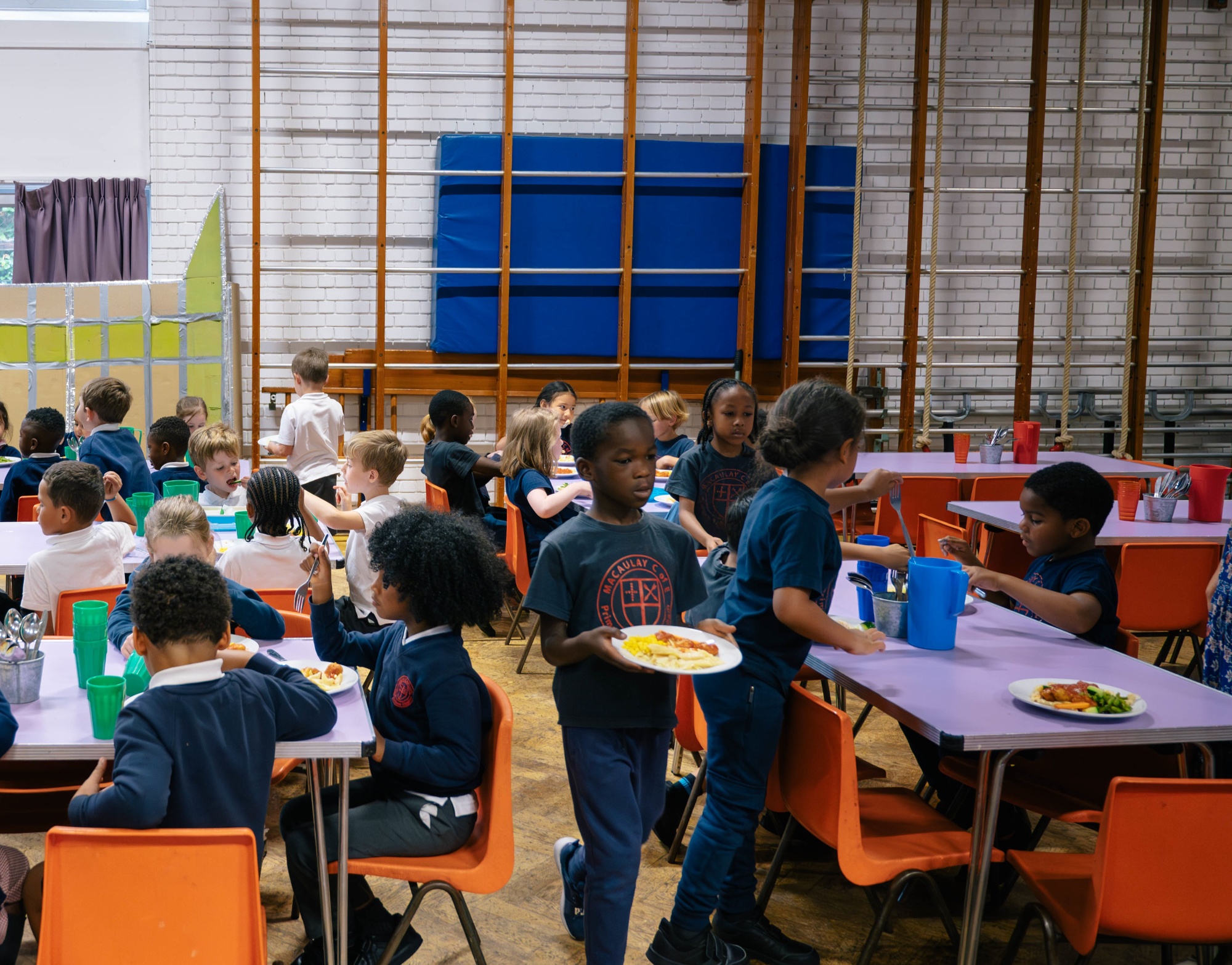 Pupils eating in the school hall