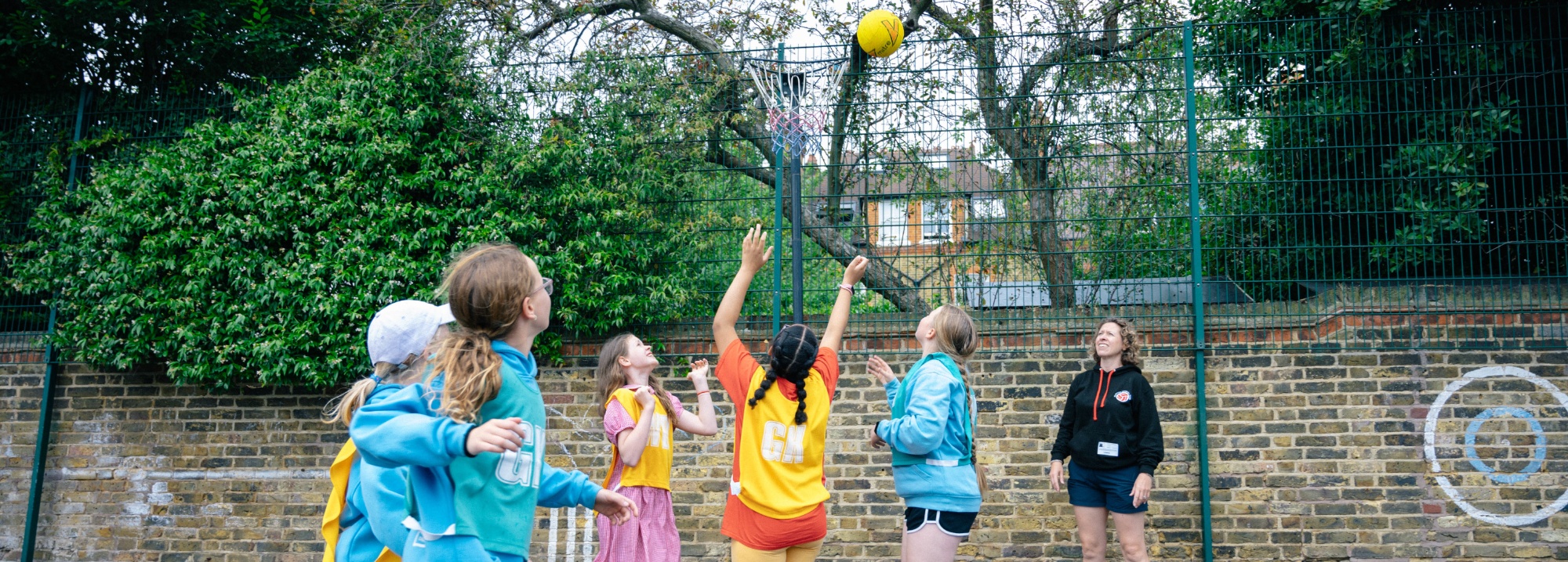 Pupils playing netball