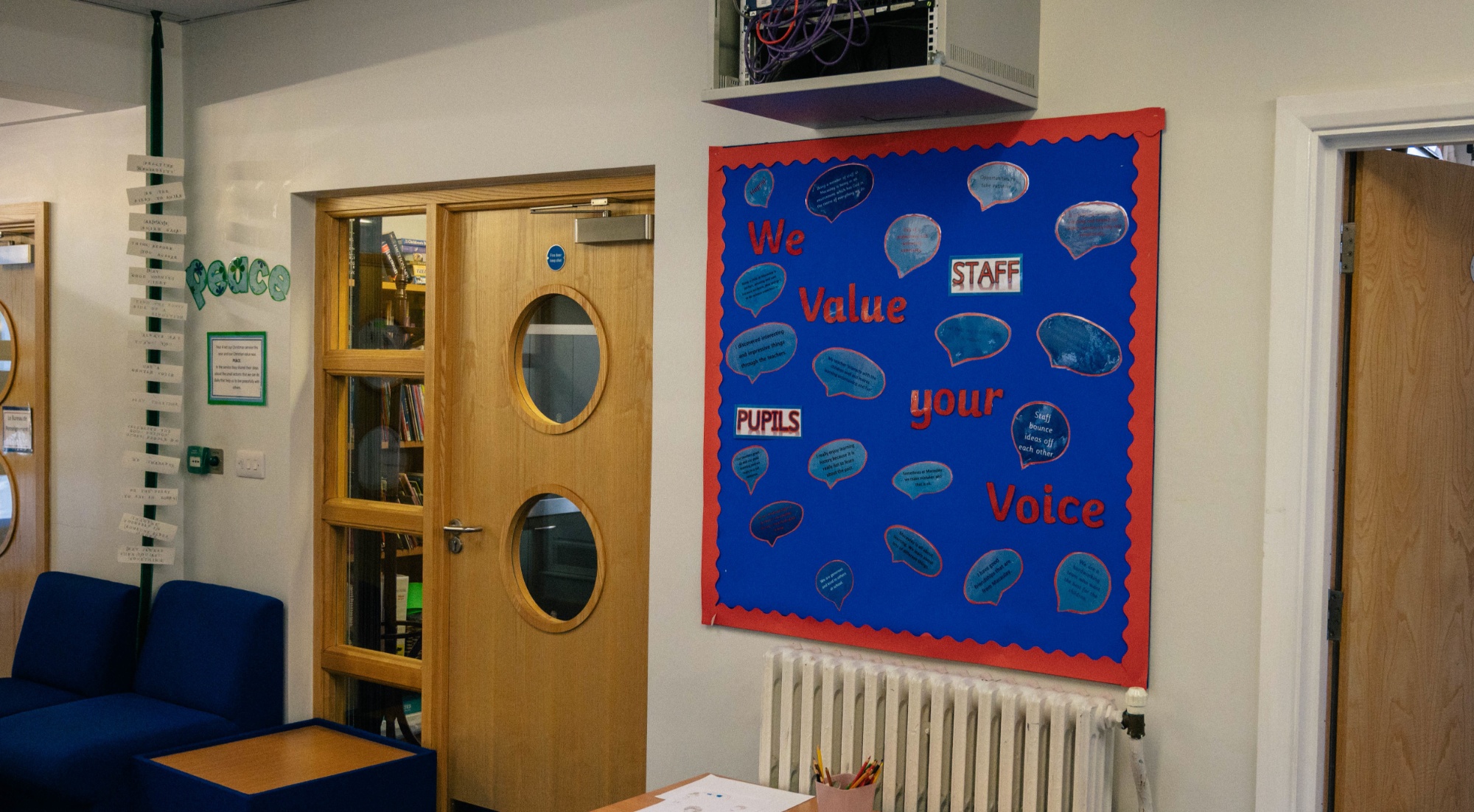 A wall display reading 'We value your voice'